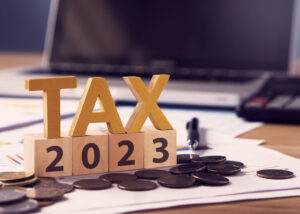 Tax wooden letter and 2023 number on wooden block.Pay tax in 2023 years.